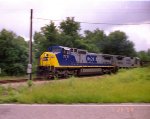 CSX 7771 leads a train towards Hamlet